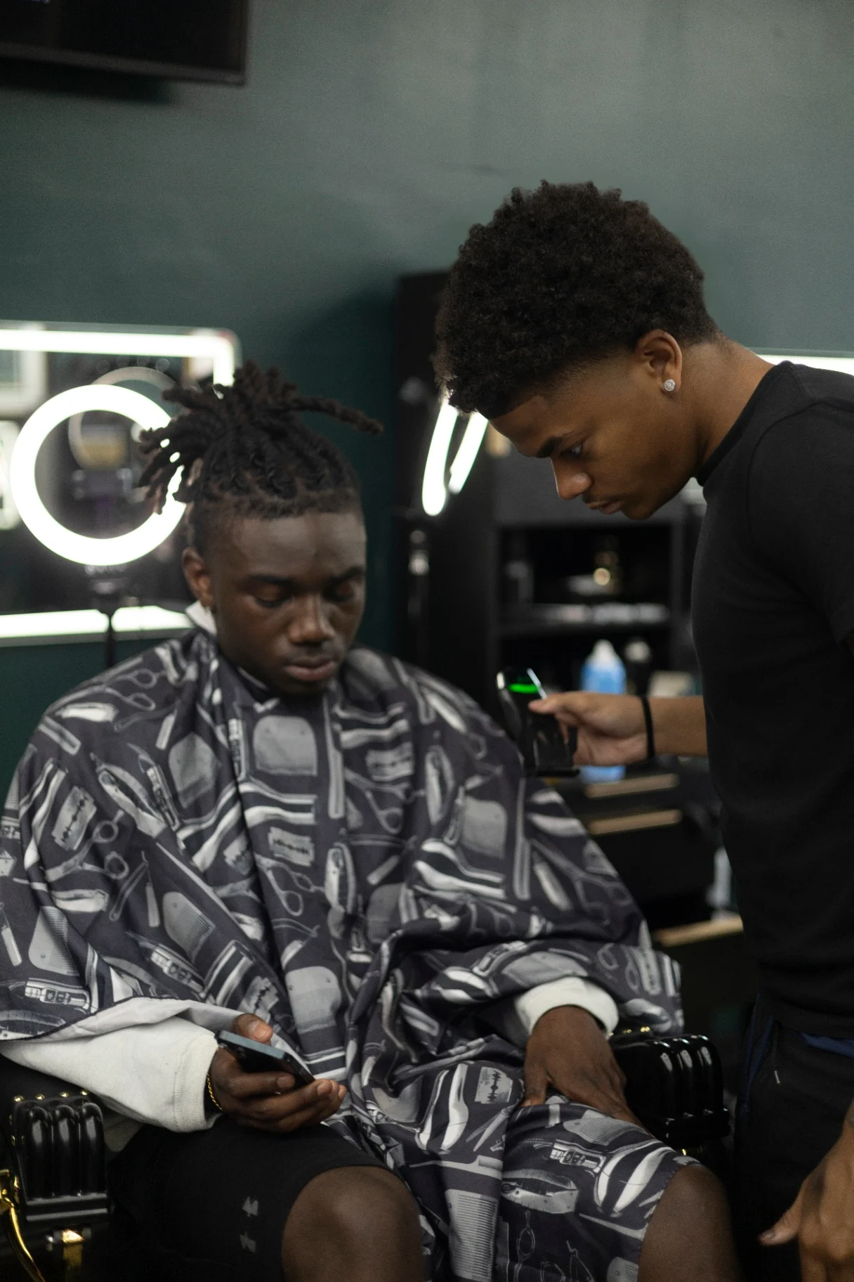 Barber working on a client at Highbridge One
